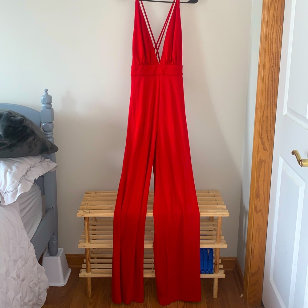 Red jumpsuit from bebe, size S